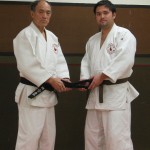 Christian receiving his blackbelt